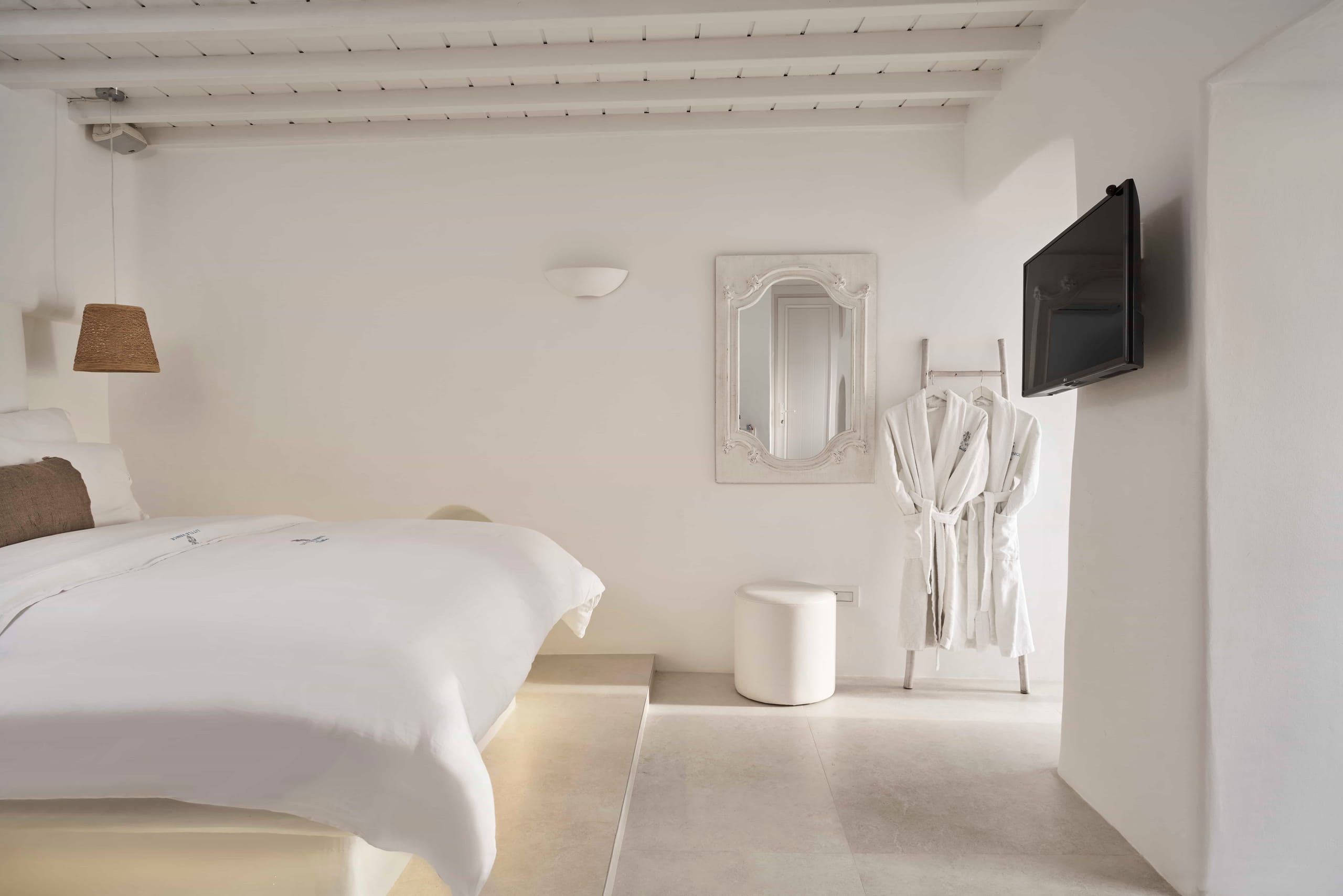 Double room with queen bed, bathrobes and wall-mounted TV